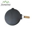 round vegetable oil cast iron skillet with wooden handle